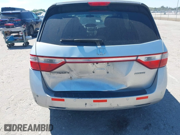 2012 Honda Odyssey Touring with VIN 5FNRL5H90CB099519, listed as a IAAI auction lot 41854550 with 185,110 mi miles. Bid and sale history available at carsss.com. Image 6.