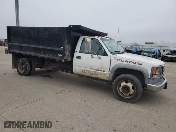 2001 GMC Sierra 1500 with VIN 3GDKC34GX1M100674, listed as a Copart auction lot 43498685 with 140,259 mi miles and Salvage Title. Bid and sale history available at DreamBid. Image 4.