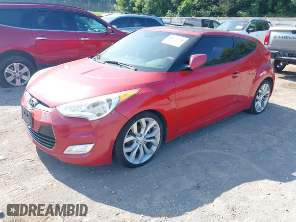2012 Hyundai Veloster w/Black Int with VIN KMHTC6AD3CU032989, listed as a IAAI auction lot 42633748 with 137,727 mi miles and . Bid and sale history available at DreamBid. Image 2.