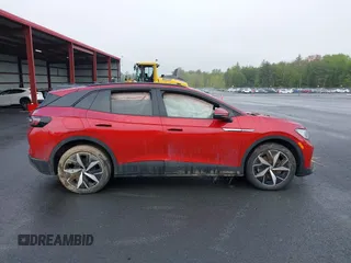 2023 Volkswagen ID.4 Pro S z VIN 1V2FMPE83PC010566, wystawiony jako IAAI lot #42255980 z przebiegiem Nie podano mil oraz . Historia ofert i sprzedaży dostępna na DreamBid. Obrazek 13.