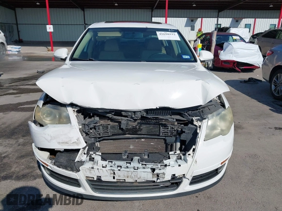 2009 Volkswagen Passat z VIN WVWJK93C29P033434, wystawiony jako IAAI lot #41698532 z przebiegiem 129 256 mil mil oraz . Historia ofert i sprzedaży dostępna na DreamBid. Obrazek 12.
