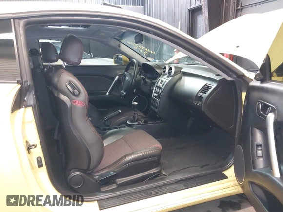 2006 Hyundai Tiburon GT z VIN KMHHN65F56U225936, wystawiony jako IAAI lot #41695280 z przebiegiem 121 110 mil mil oraz . Historia ofert i sprzedaży dostępna na DreamBid. Obrazek 5.