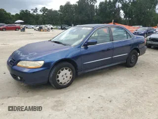 2001 Honda Accord LX with VIN 1HGCG564X1A040275, listed as a Copart auction lot 63300275 with 216,079 mi miles and Salvage title. Bid and sale history available at DreamBid. Image 1.