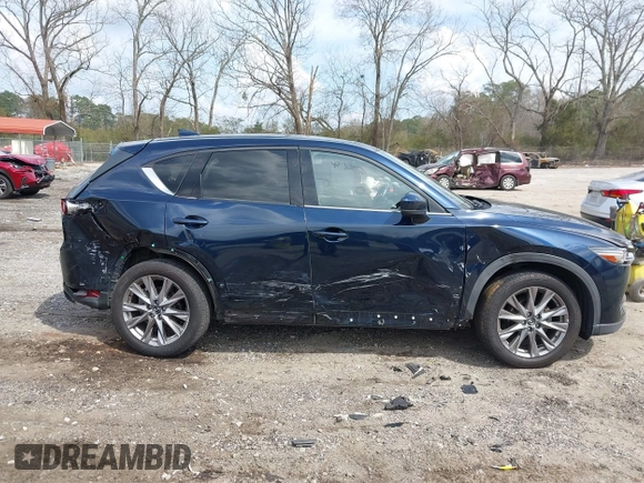 2021 Mazda CX-5 Grand Touring with VIN JM3KFBDM8M0484383, listed as a IAAI auction lot 41800786 with 58,617 mi miles. Bid and sale history available at carsss.com. Image 13.