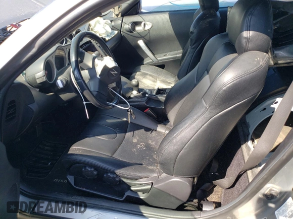 2005 Nissan 350Z with VIN JN1AZ34D05M606703, listed as a Copart auction lot 69631414 with 133,519 mi miles and Salvage Title. Bid and sale history available at DreamBid. Image 7.
