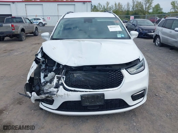 2021 Chrysler Pacifica Hybrid Touring L with VIN 2C4RC1L79MR597058, listed as a IAAI auction lot 40344372 with 80,566 mi miles. Bid and sale history available at carsss.com. Image 12.