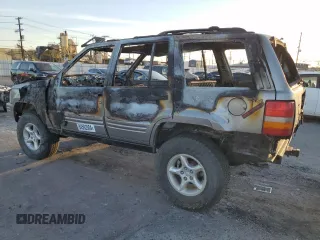 1998 Jeep Grand Cherokee Limited with VIN 1J4GZ88Z5WC119542, listed as a Copart auction lot 84562304 with 0 mi miles and Non Repairable. Bid and sale history available at carsss.com. Image 2.