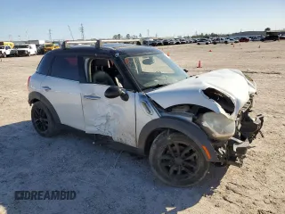 2011 MINI Countryman with VIN WMWZB3C59BWH94541, listed as a Copart auction lot 87177514 with 186,979 mi miles and Salvage title. Bid and sale history available at DreamBid. Image 4.