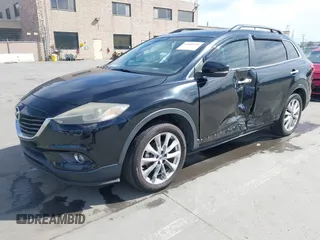2015 Mazda CX-9 Grand Touring z VIN JM3TB2DA4F0450014, wystawiony jako IAAI lot #41692935 z przebiegiem 90 800 mil mil oraz . Historia ofert i sprzedaży dostępna na DreamBid. Obrazek 2.