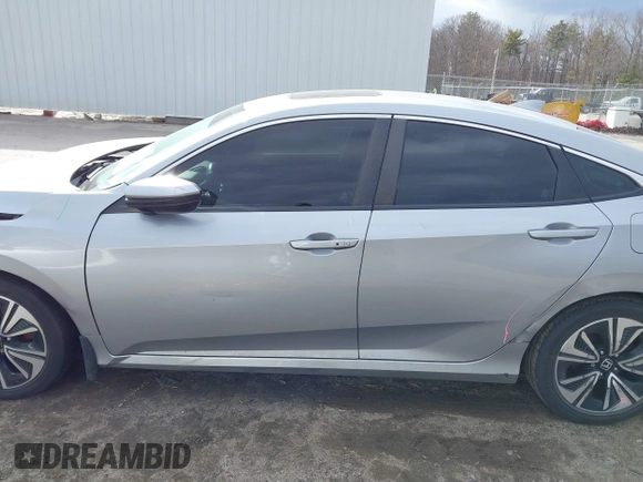 2018 Honda Civic EX-T z VIN 2HGFC1F34JH641837, wystawiony jako IAAI lot #41858089 z przebiegiem 65 318 mil mil oraz . Historia ofert i sprzedaży dostępna na DreamBid. Obrazek 14.