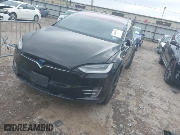 2021 Tesla Model X Long Range Plus with VIN 5YJXCAE27MF324270, listed as a IAAI auction lot 41886101 with 59,614 mi miles and . Bid and sale history available at carsss.com. Image 2.