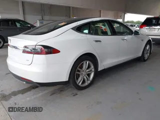 2014 Tesla Model S 60 with VIN 5YJSA1S16EFP53350, listed as a IAAI auction lot 42239753 with 104,985 mi miles and . Bid and sale history available at DreamBid. Image 4.