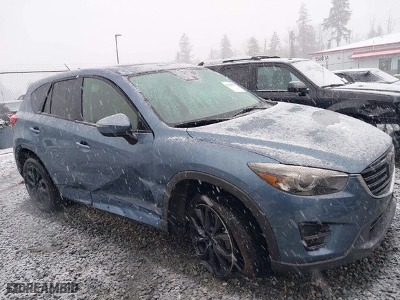 2016 Mazda CX-5 Grand Touring with VIN JM3KE4DY4G0687230, listed as a IAAI auction lot 41510915 with NaN miles. Bid and sale history available at carsss.com. Image 6.