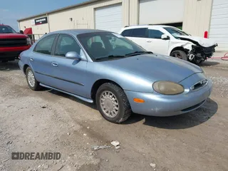 1998 Mercury Sable GS z VIN 1MEFM50U3WG643083, wystawiony jako IAAI lot #42481534 z przebiegiem 115 146 mil mil oraz . Historia ofert i sprzedaży dostępna na DreamBid. Obrazek 1.