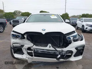 2021 BMW X6 xDrive40i z VIN 5UXCY6C00M9F88215, wystawiony jako IAAI lot #41646498 z przebiegiem 43 587 mil mil oraz . Historia ofert i sprzedaży dostępna na DreamBid. Obrazek 6.