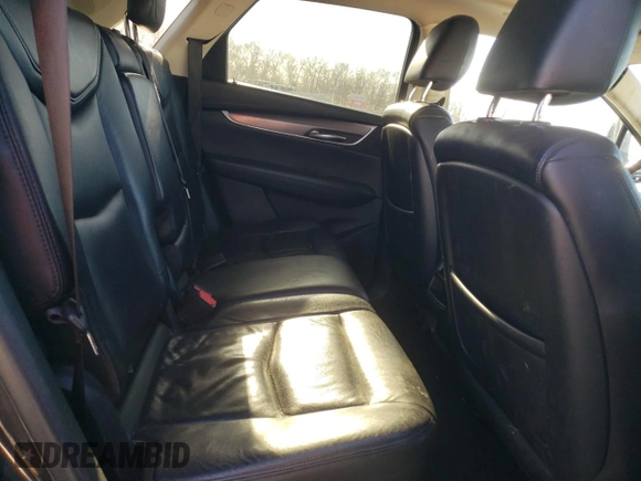 2017 Cadillac XT5 Premium Luxury FWD z VIN 1GYKNCRS2HZ114664, wystawiony jako Copart lot #84624944 z przebiegiem 153 882 mil mil oraz Szkody całkowita. Historia ofert i sprzedaży dostępna na DreamBid. Obrazek 11.