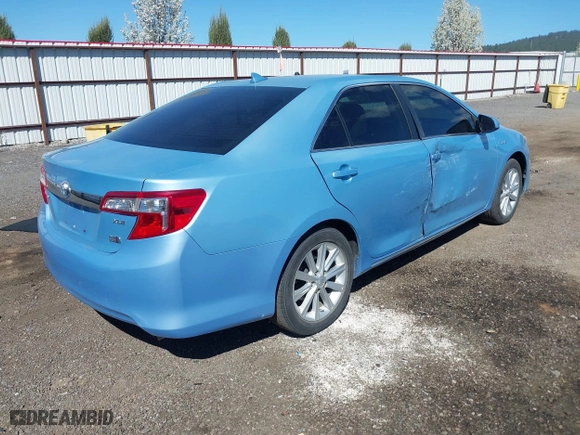 2014 Toyota Camry Hybrid LE with VIN 4T1BD1FK7EU098824, listed as a IAAI auction lot 42063119 with 112,759 mi miles. Bid and sale history available at carsss.com. Image 4.