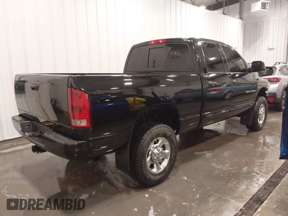 2005 Dodge Ram 3500 SLT with VIN 3D7LS38C85G810265, listed as a IAAI auction lot 41856058 with 164,027 mi miles. Bid and sale history available at carsss.com. Image 4.