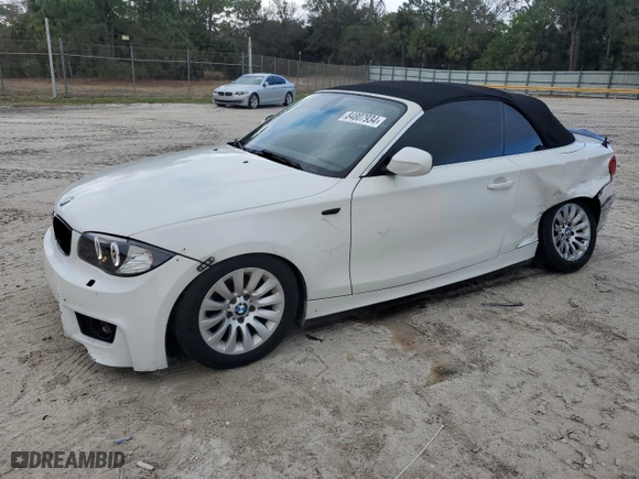 2011 BMW 1 Series 128i with VIN WBAUL7C55BVM79611, listed as a Copart auction lot 84807934 with 161,099 mi miles and Salvage Title. Bid and sale history available at carsss.com. Image 1.