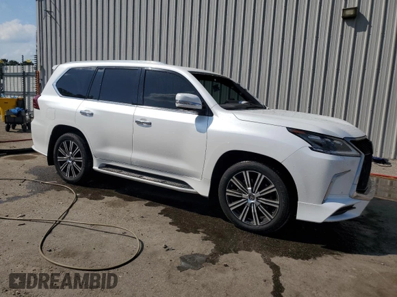 2020 Lexus LX 570 with VIN JTJDY7AX6L4332372, listed as a Copart auction lot 57315675 with 132,418 mi miles and Salvage title. Bid and sale history available at DreamBid. Image 4.