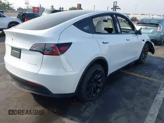 2023 Tesla Model Y Long Range with VIN 7SAYGDEE3PF900030, listed as a IAAI auction lot 41147192 with 13,903 mi miles and . Bid and sale history available at DreamBid. Image 4.