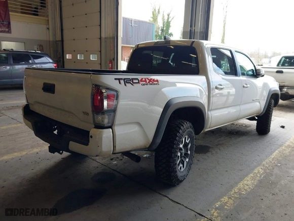 2020 Toyota Tacoma 4WD SR5 with VIN 5TFCZ5AN6LX235847, listed as a IAAI auction lot 41676928 with 77,384 mi miles. Bid and sale history available at carsss.com. Image 4.