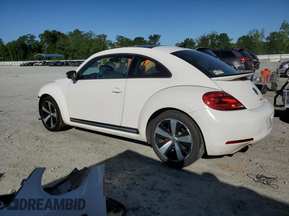2012 Volkswagen Beetle 2.0T Turbo w/Sun/Snd/Nav PZEV with VIN 3VWVA7AT7CM631038, listed as a Copart auction lot 50749973 with 75,581 mi miles and Salvage Title. Bid and sale history available at carsss.com. Image 2.