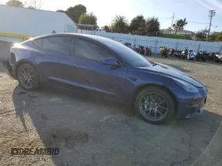 2022 Tesla Model 3 Long Range with VIN 5YJ3E1EB6NF255730, listed as a Copart auction lot 46354235 with 58,470 mi miles and Salvage Title. Bid and sale history available at DreamBid. Image 4.