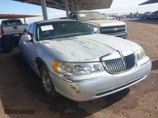 2002 Lincoln Town Car Cartier with VIN 1LNHM83W82Y671518, listed as a IAAI auction lot 41585081 with 134,083 mi miles. Bid and sale history available at carsss.com. Image 1.