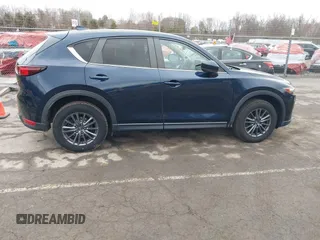 2021 Mazda CX-5 Touring with VIN JM3KFBCM7M1380396, listed as a IAAI auction lot 41707612 with 55,555 mi miles. Bid and sale history available at carsss.com. Image 13.