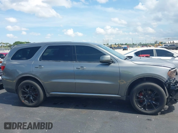 2013 Dodge Durango SXT with VIN 1C4RDHAGXDC500144, listed as a IAAI auction lot 42693122 with 194,519 mi miles and . Bid and sale history available at DreamBid. Image 13.