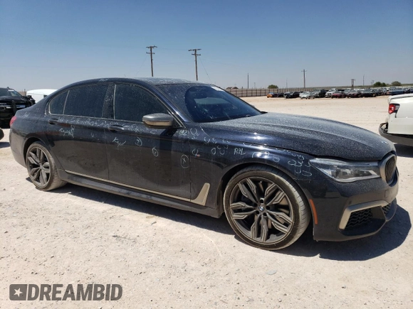 2018 BMW 7 Series M760i xDrive with VIN WBA7H6C51JG614580, listed as a Copart auction lot 65748304 with 46,801 mi miles and Clean Title. Bid and sale history available at carsss.com. Image 4.