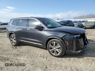 2021 Cadillac XT6 Premium Luxury z VIN 1GYKPCRS6MZ205831, wystawiony jako Copart lot #47259215 z przebiegiem 31 959 mil mil oraz Szkody całkowita. Historia ofert i sprzedaży dostępna na DreamBid. Obrazek 4.