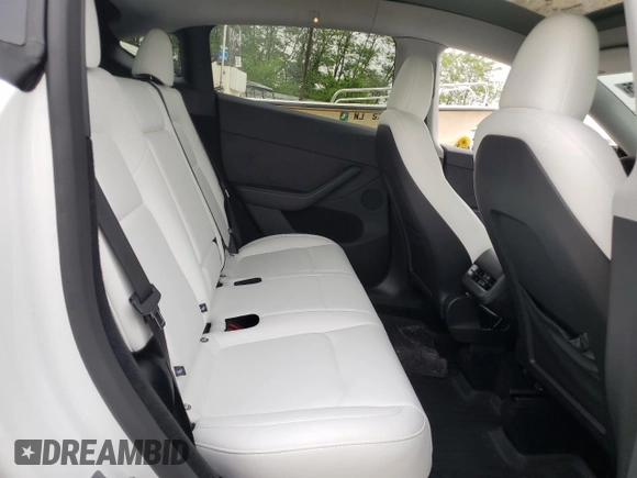 2024 Tesla Model Y Long Range with VIN 7SAYGDEE2RA329081, listed as a Copart auction lot 57254265 with 2,325 mi miles and Salvage title. Bid and sale history available at DreamBid. Image 11.