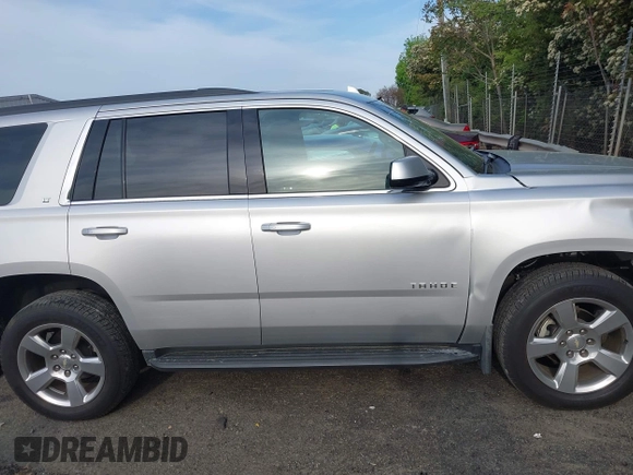 2019 Chevrolet Tahoe LT with VIN 1GNSCBKCXKR219413, listed as a IAAI auction lot 42013260 with 92,886 mi miles and . Bid and sale history available at DreamBid. Image 14.