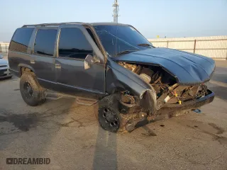 1999 Chevrolet Tahoe with VIN 1GNEC13R0XJ495650, listed as a Copart auction lot 85348144 with 0 mi miles and Salvage Title. Bid and sale history available at carsss.com. Image 4.