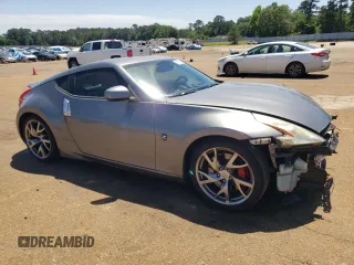 2014 Nissan 370Z Nismo with VIN JN1AZ4EH7EM633324, listed as a Copart auction lot 53812335 with 57,856 mi miles and Salvage Title. Bid and sale history available at DreamBid. Image 4.