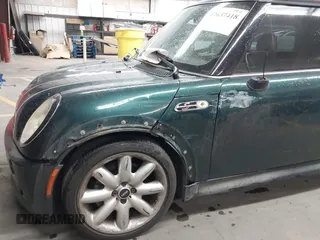 2006 MINI Hardtop S z VIN WMWRE33536TJ40341, wystawiony jako IAAI lot #42637418 z przebiegiem 93 338 mil mil oraz . Historia ofert i sprzedaży dostępna na DreamBid. Obrazek 6.