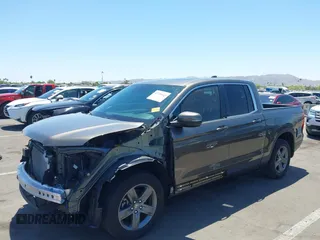 2022 Honda Ridgeline RTL with VIN 5FPYK3F58NB007618, listed as a IAAI auction lot 42258443 with 14,036 mi miles and . Bid and sale history available at DreamBid. Image 2.