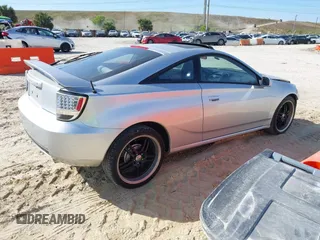 2002 Toyota Celica GT with VIN JTDDR32TX20129902, listed as a IAAI auction lot 41443750 with 203,652 mi miles. Bid and sale history available at carsss.com. Image 4.