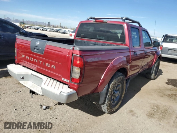 2003 Nissan Frontier XE with VIN 1N6ED27T13C409632, listed as a Copart auction lot 84884434 with 194,167 mi miles and Salvage title. Bid and sale history available at DreamBid. Image 3.