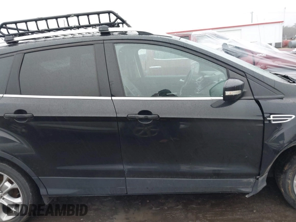 2015 Ford Escape Titanium with VIN 1FMCU0J97FUB45709, listed as a IAAI auction lot 41561636 with 88,296 mi miles. Bid and sale history available at carsss.com. Image 13.