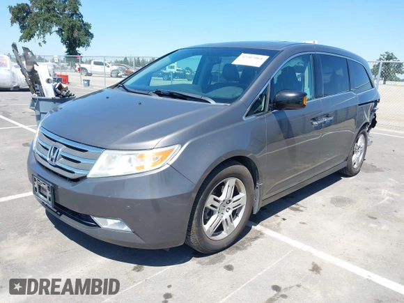 2012 Honda Odyssey Touring with VIN 5FNRL5H98CB011297, listed as a IAAI auction lot 42207061 with 154,073 mi miles and . Bid and sale history available at DreamBid. Image 2.