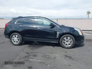 2014 Cadillac SRX Luxury Collection z VIN 3GYFNEE30ES650372, wystawiony jako IAAI lot #42195783 z przebiegiem 169 113 mil mil oraz . Historia ofert i sprzedaży dostępna na DreamBid. Obrazek 13.