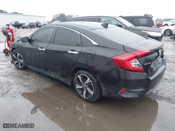 2017 Honda Civic Sedan Touring with VIN 2HGFC1F99HH658034, listed as a IAAI auction lot 41563627 with 140,819 mi miles. Bid and sale history available at carsss.com. Image 3.