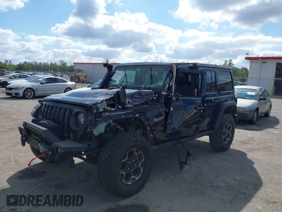 2023 Jeep Wrangler Rubicon with VIN 1C4HJXFGXPW534515, listed as a IAAI auction lot 41524419 with 21,376 mi miles and . Bid and sale history available at DreamBid. Image 6.