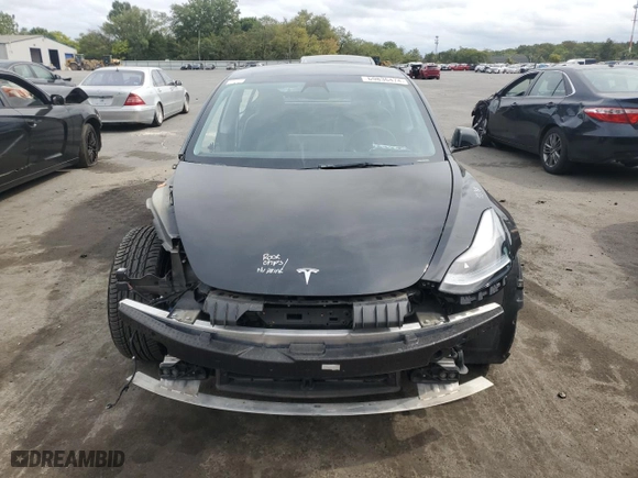 2022 Tesla Model 3 Long Range with VIN 5YJ3E1EB5NF288377, listed as a Copart auction lot 69836474 with 65,736 mi miles and Salvage Title. Bid and sale history available at carsss.com. Image 5.