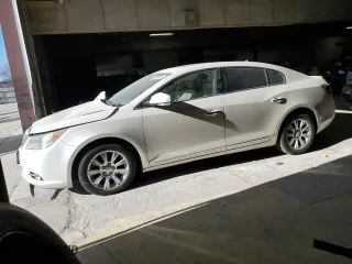 2012 Buick LaCrosse Leather with VIN 1G4GC5ERXCF202741, listed as a Copart auction lot 83573004 with 157,725 mi miles and Salvage Title. Bid and sale history available at carsss.com. Image 1.