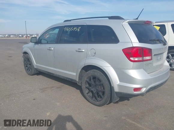 2013 Dodge Journey SXT with VIN 3C4PDDBG9DT680798, listed as a IAAI auction lot 41655958 with 140,594 mi miles and . Bid and sale history available at DreamBid. Image 3.