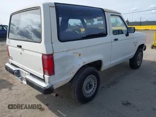 1986 Ford Bronco z VIN 1FMCU14T0GUC51692, wystawiony jako IAAI lot #41982392 z przebiegiem 509 734 mil mil oraz . Historia ofert i sprzedaży dostępna na DreamBid. Obrazek 4.